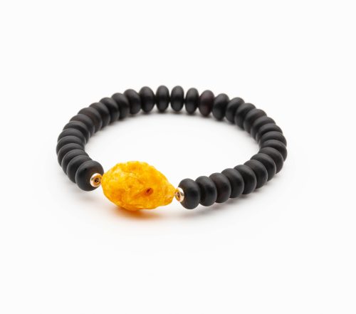 Luxury matte black amber bracelet for men decorated with one larger piece of amber